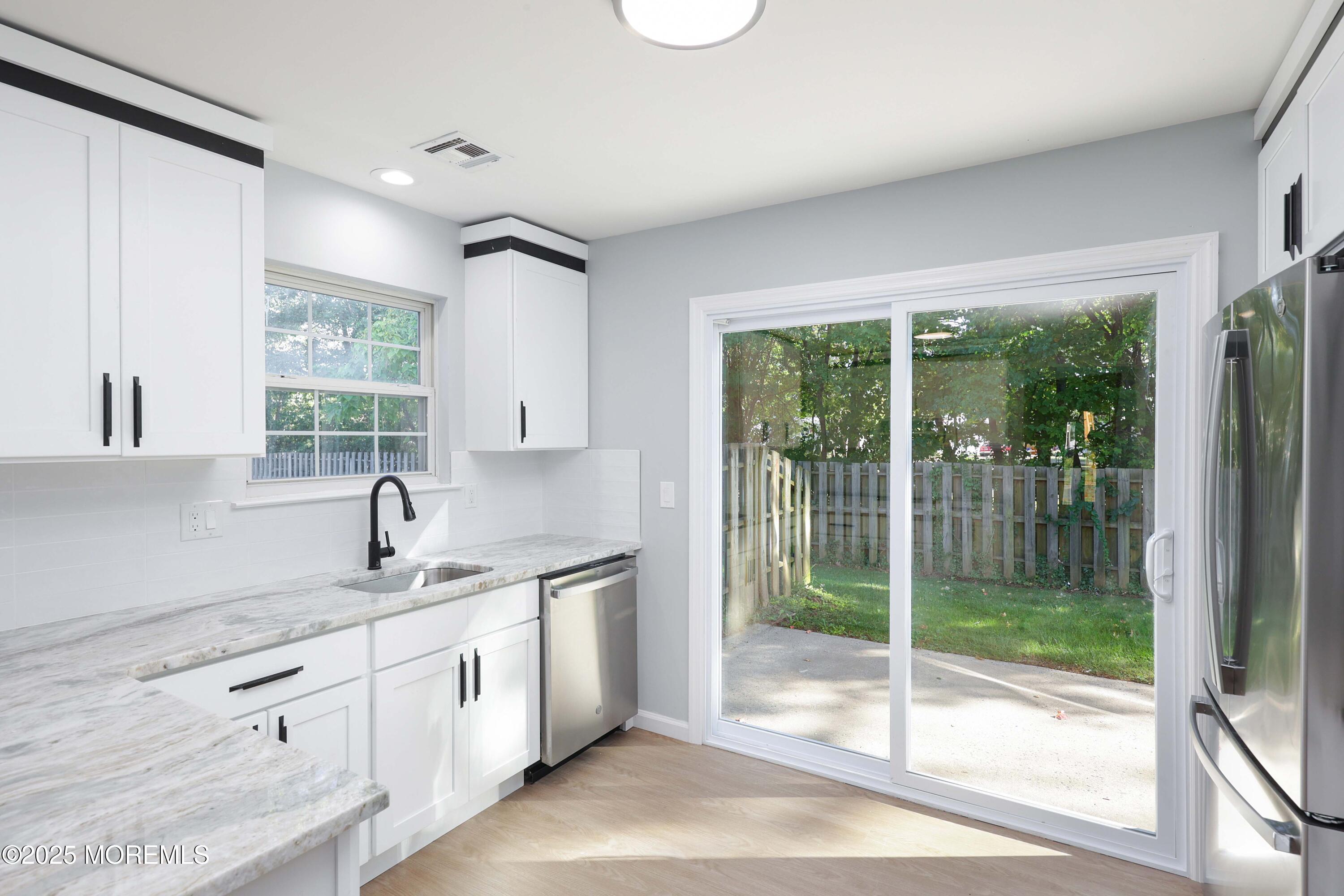 4 Ellison Court Union Beach, NJ 07735 - Photo 9 of 35 a kitchen with a sink and large window
