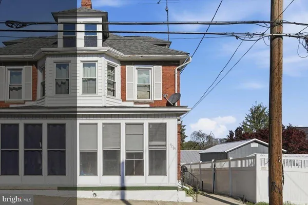 a aerial view of a house with a yard