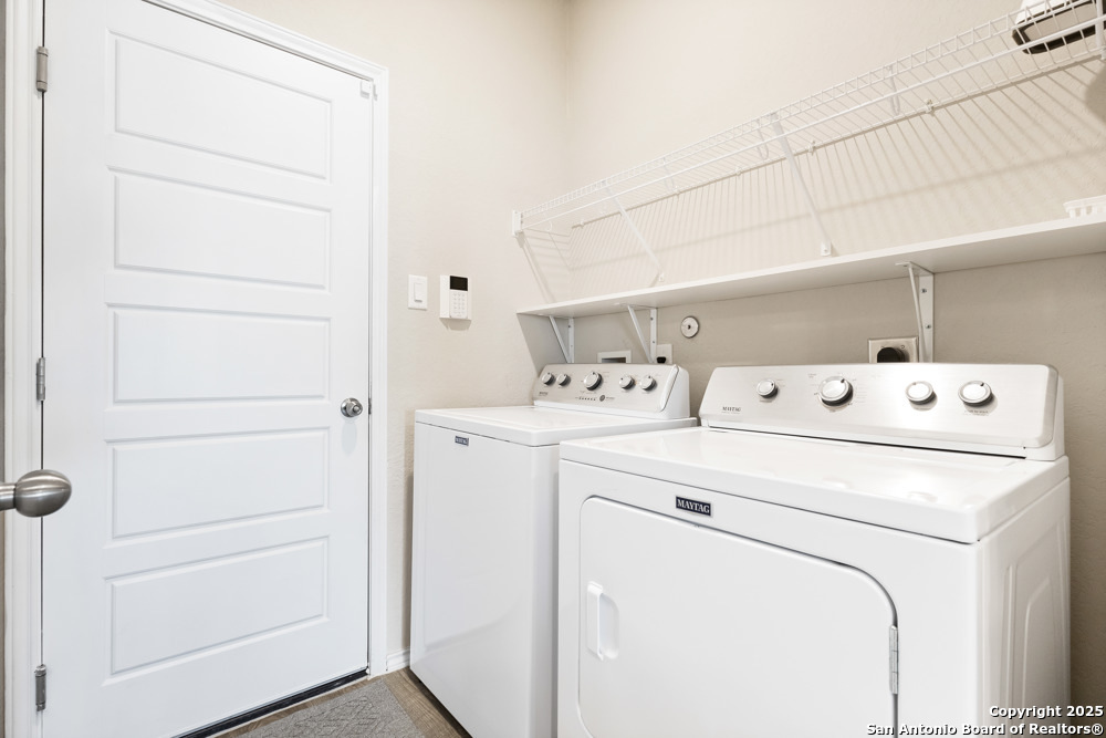 19916 Doc Holiday Drive Lytle, TX 78052 - Photo 24 of 27 a utility room with dryer and washer