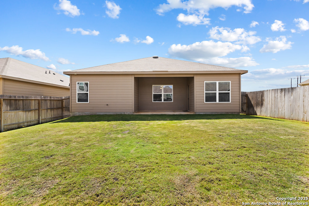 19916 Doc Holiday Drive Lytle, TX 78052 - Photo 27 of 27 a view of a house with a backyard