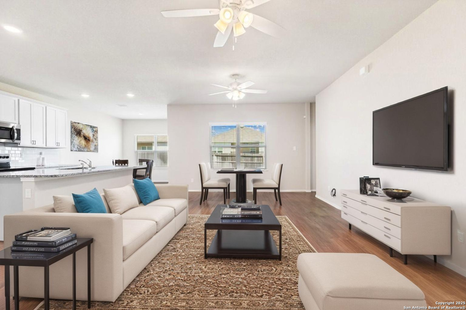 19916 Doc Holiday Drive Lytle, TX 78052 - Photo 3 of 27 a living room with furniture and a flat screen tv