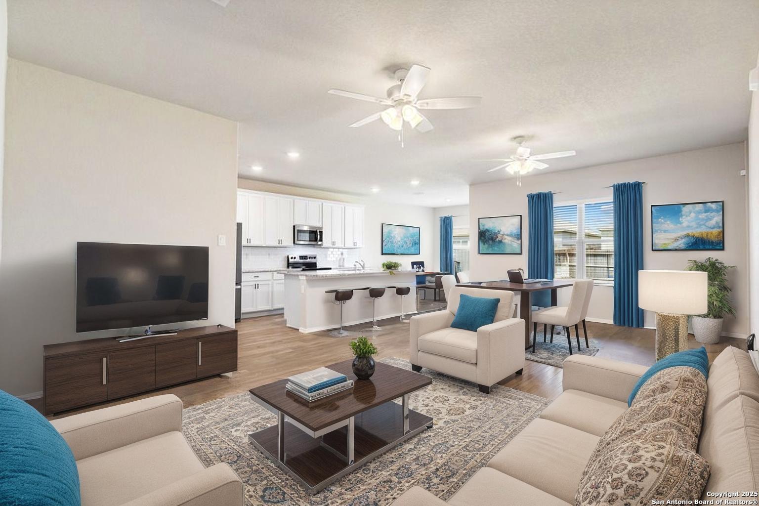 19916 Doc Holiday Drive Lytle, TX 78052 - Photo 5 of 27 a living room with furniture and a flat screen tv