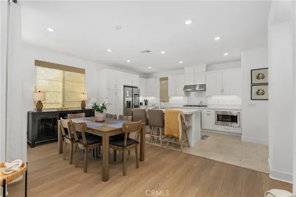 a view of a dining area with furniture and wooden floor