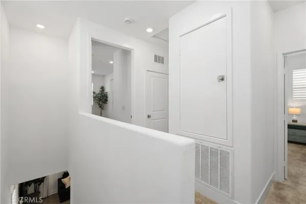 a bathroom with a toilet a sink and a mirror