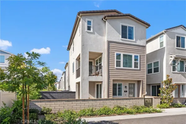 a view of a white house with large windows