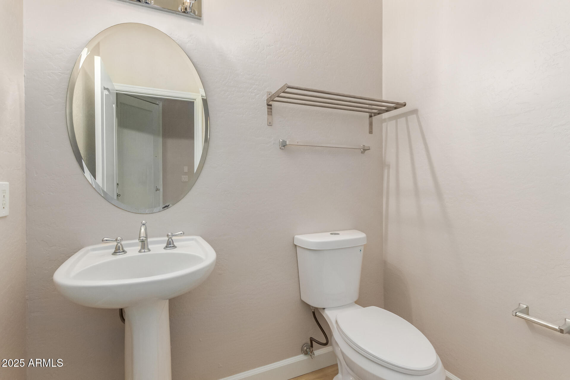 705 West Queen Creek Road, Unit 1208 Chandler, AZ 85248 - Photo 11 of 39 a white toilet sitting next to a bathroom sink
