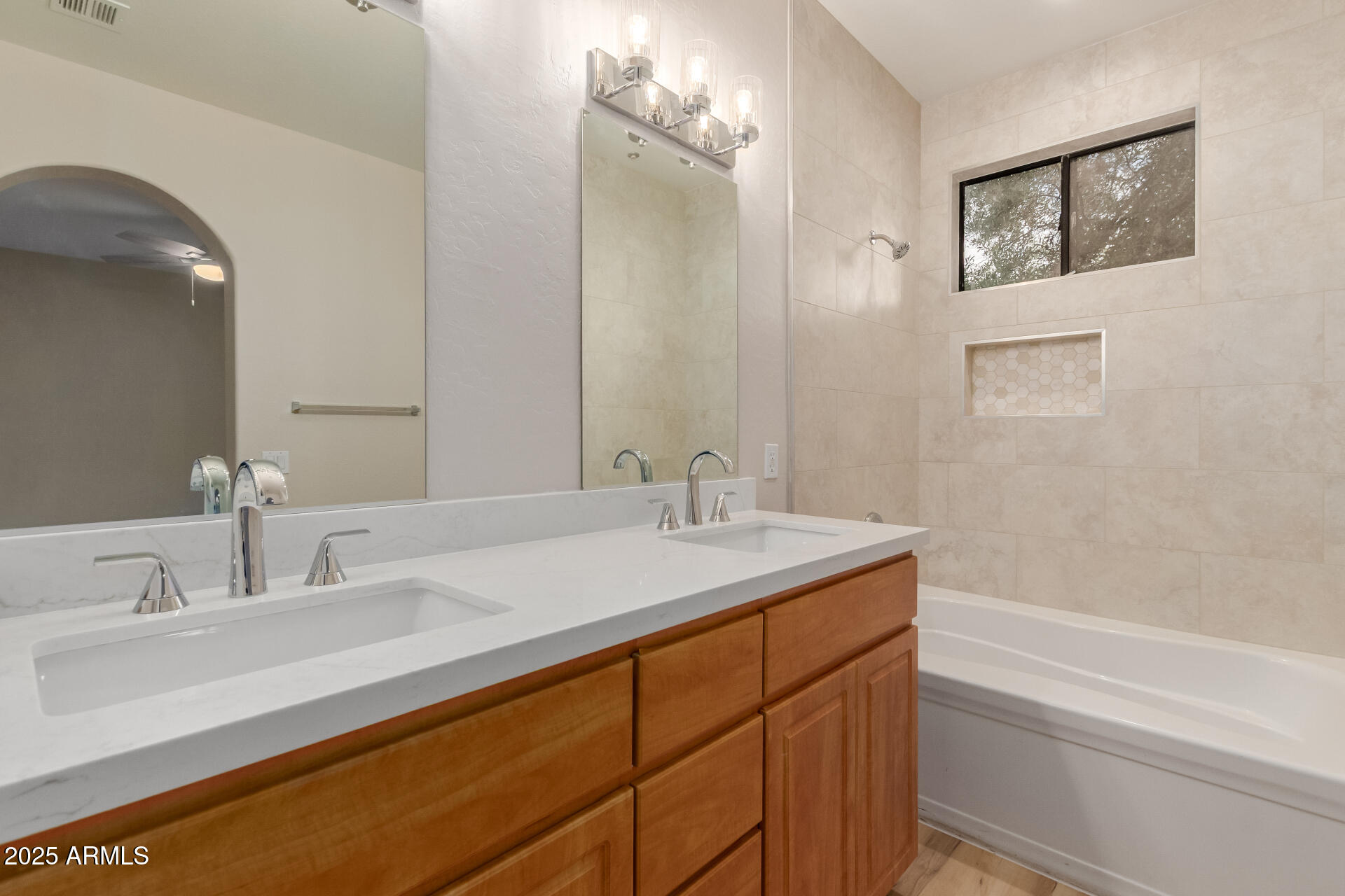705 West Queen Creek Road, Unit 1208 Chandler, AZ 85248 - Photo 15 of 39 a bathroom with a sink and a mirror
