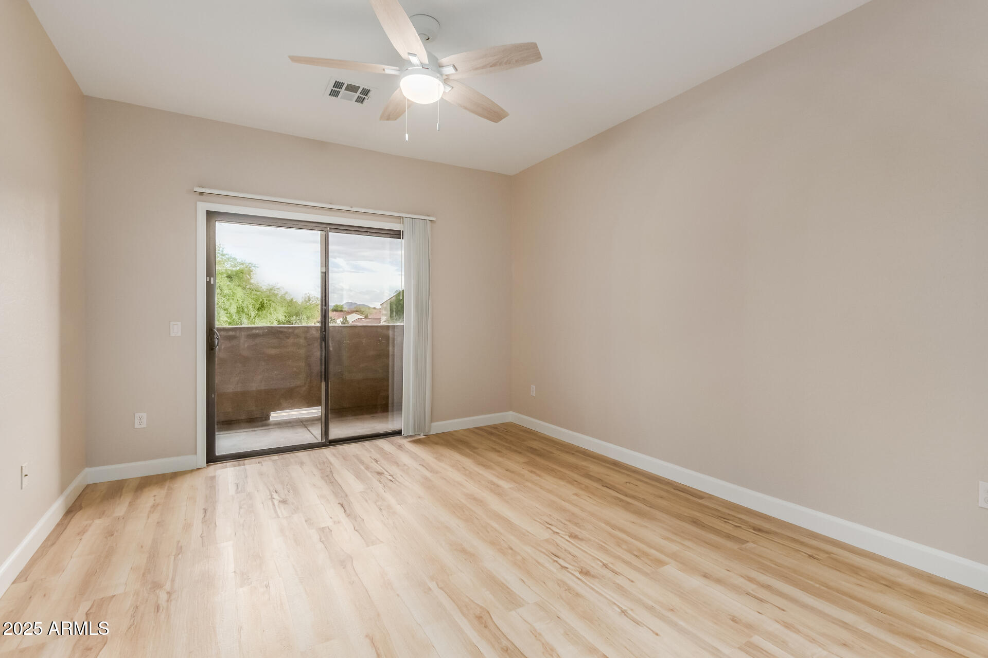 705 West Queen Creek Road, Unit 1208 Chandler, AZ 85248 - Photo 15 of 43 wooden floor in an empty room with a window