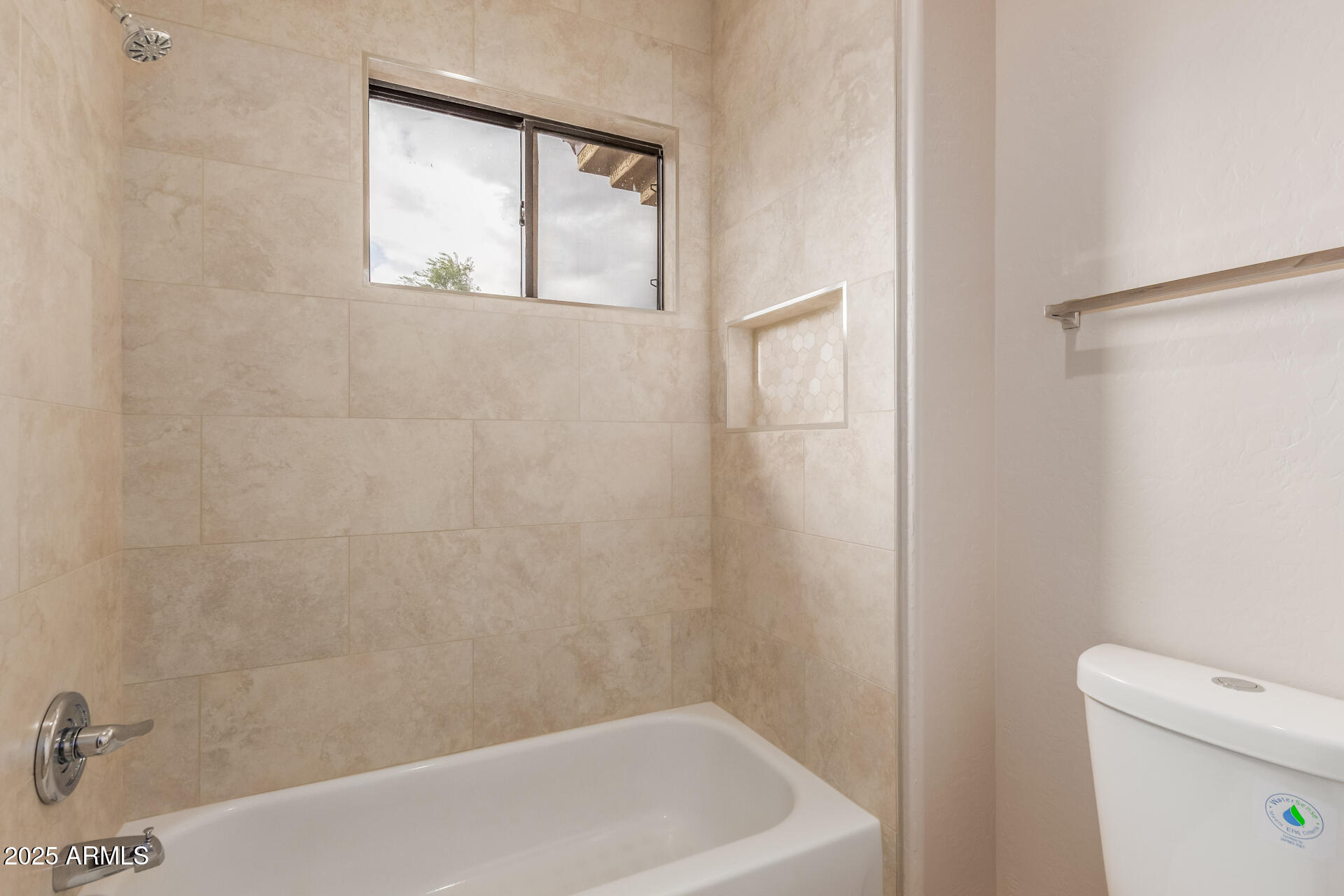 705 West Queen Creek Road, Unit 1208 Chandler, AZ 85248 - Photo 17 of 43 a bath tub sitting next to a white toilet and a sink