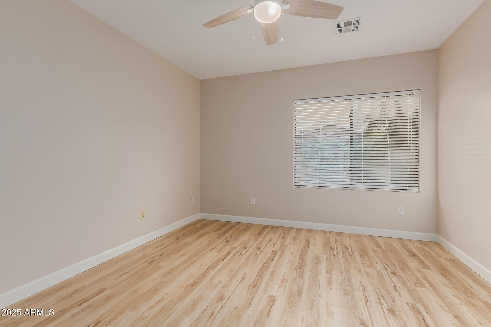 705 West Queen Creek Road, Unit 1208 Chandler, AZ 85248 - Photo 17 of 39 wooden floor in an empty room with a window
