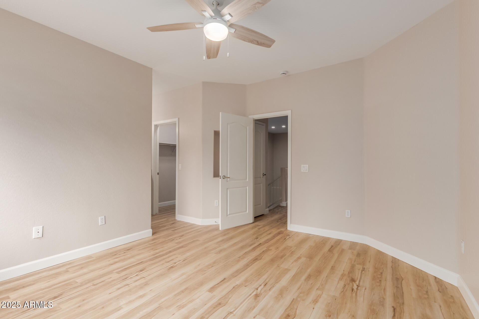 705 West Queen Creek Road, Unit 1208 Chandler, AZ 85248 - Photo 21 of 43 a view of an empty room with wooden floor