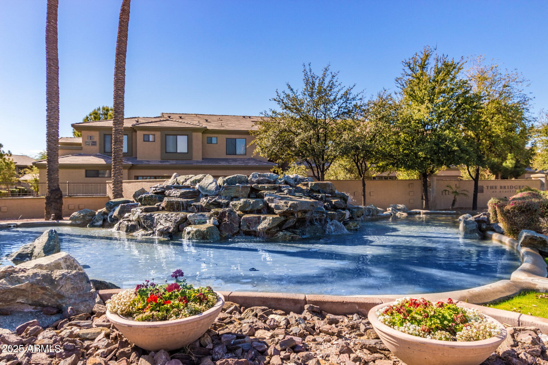 705 West Queen Creek Road, Unit 1208 Chandler, AZ 85248 - Photo 27 of 39 a view of a swimming pool with some plants and trees