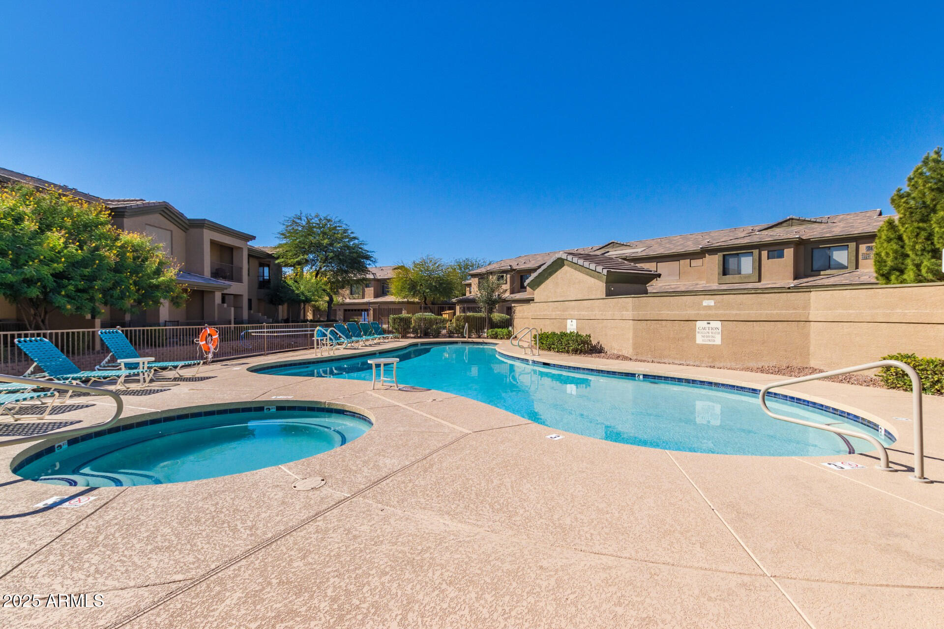 705 West Queen Creek Road, Unit 1208 Chandler, AZ 85248 - Photo 30 of 39 a view of a swimming pool with a yard