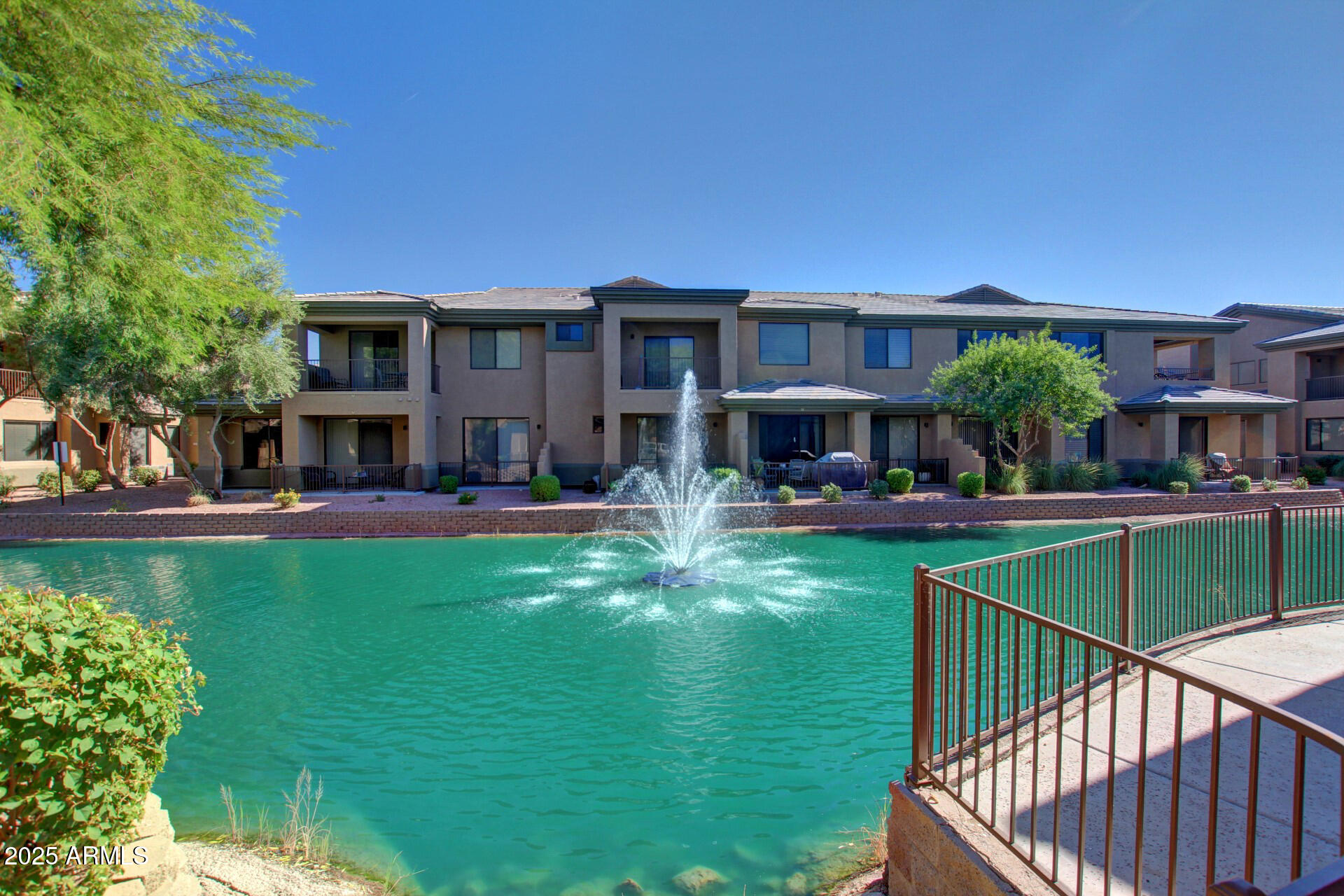 705 West Queen Creek Road, Unit 1208 Chandler, AZ 85248 - Photo 35 of 39 a front view of a house with swimming pool having outdoor seating