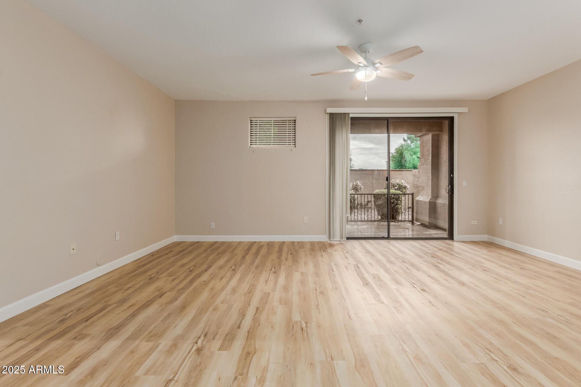 705 West Queen Creek Road, Unit 1208 Chandler, AZ 85248 - Photo 4 of 39 wooden floor in an empty room with a window