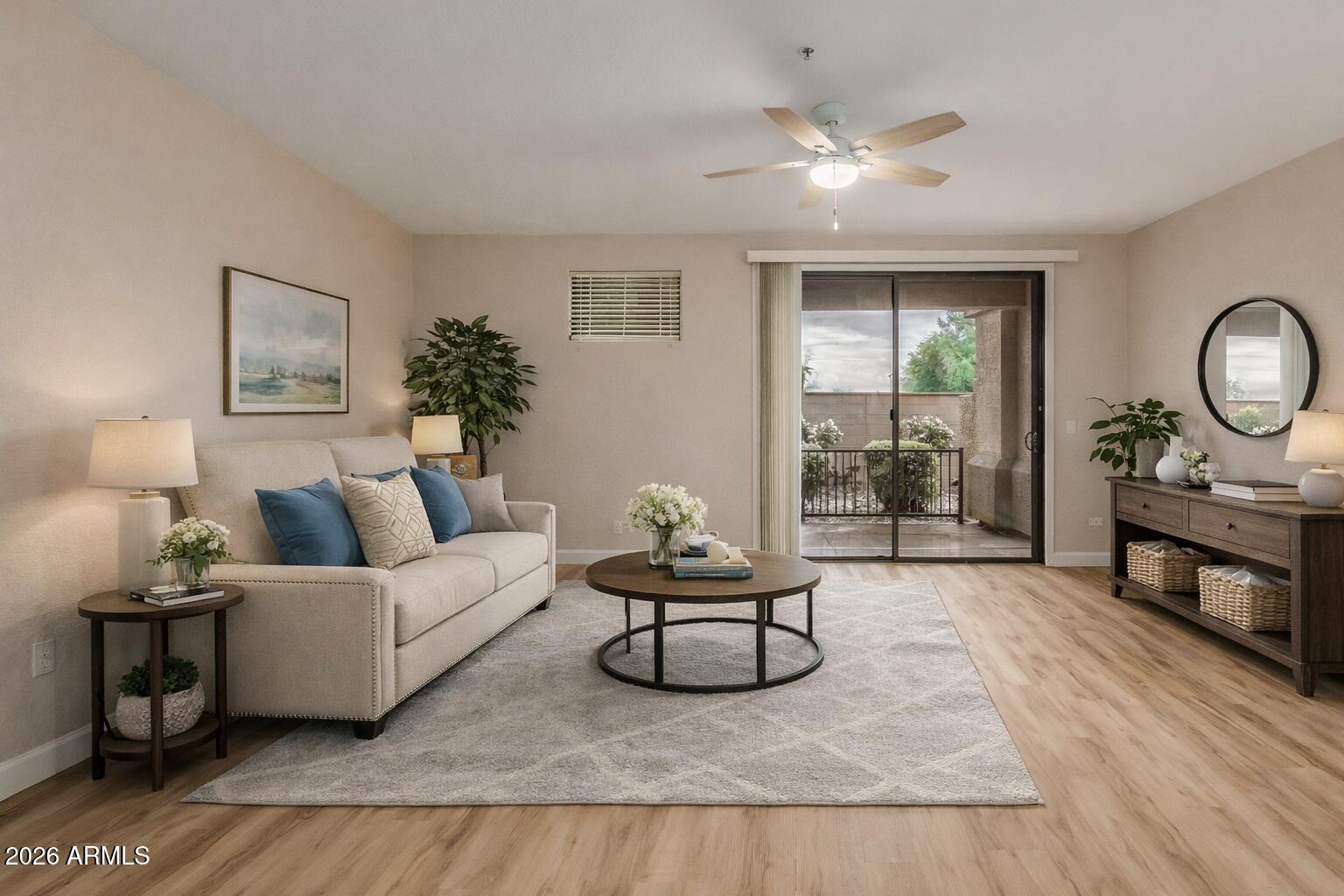 705 West Queen Creek Road, Unit 1208 Chandler, AZ 85248 - Photo 4 of 43 a living room with furniture and wooden floor