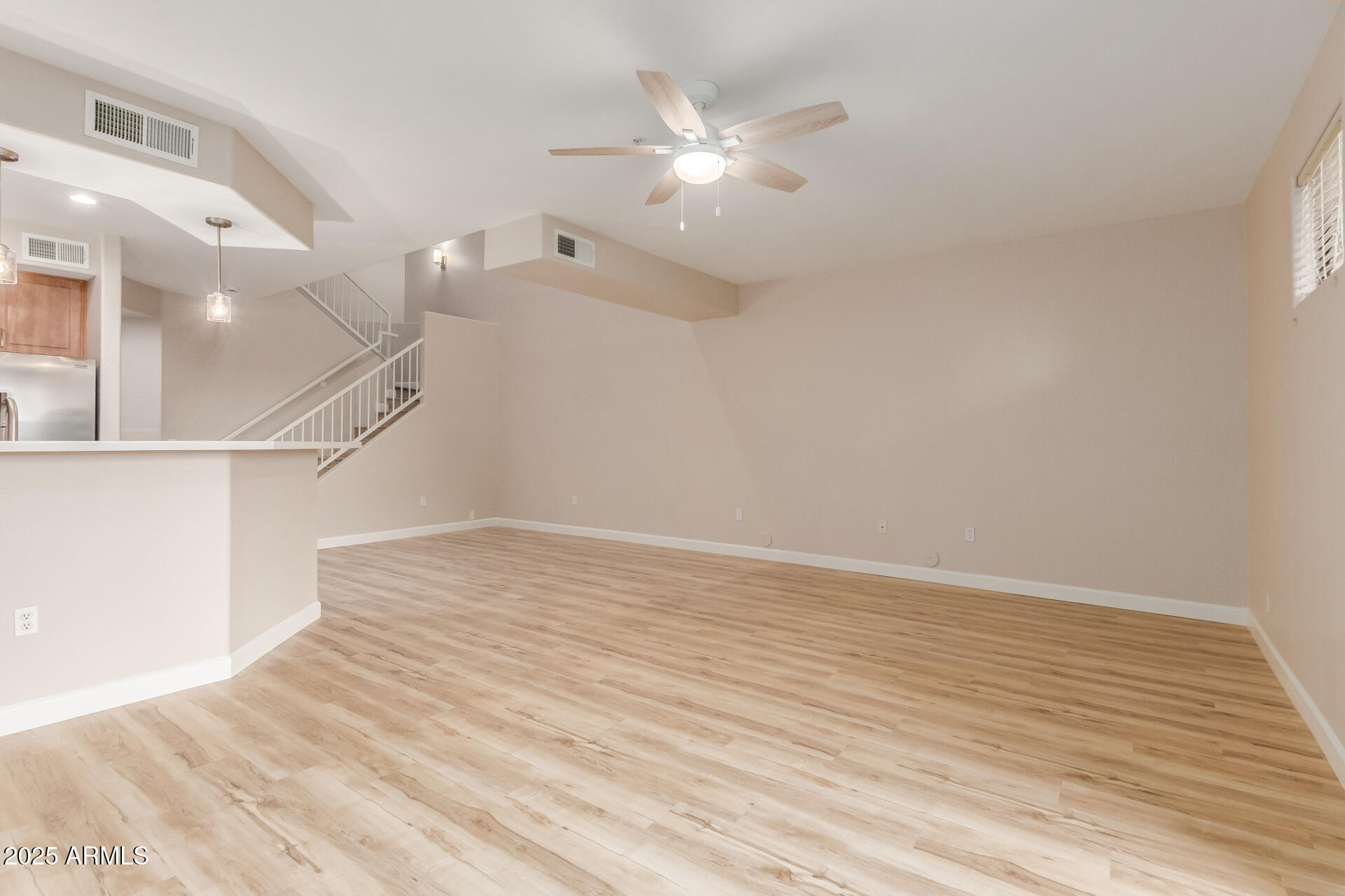 705 West Queen Creek Road, Unit 1208 Chandler, AZ 85248 - Photo 7 of 39 a view of an empty room with a window