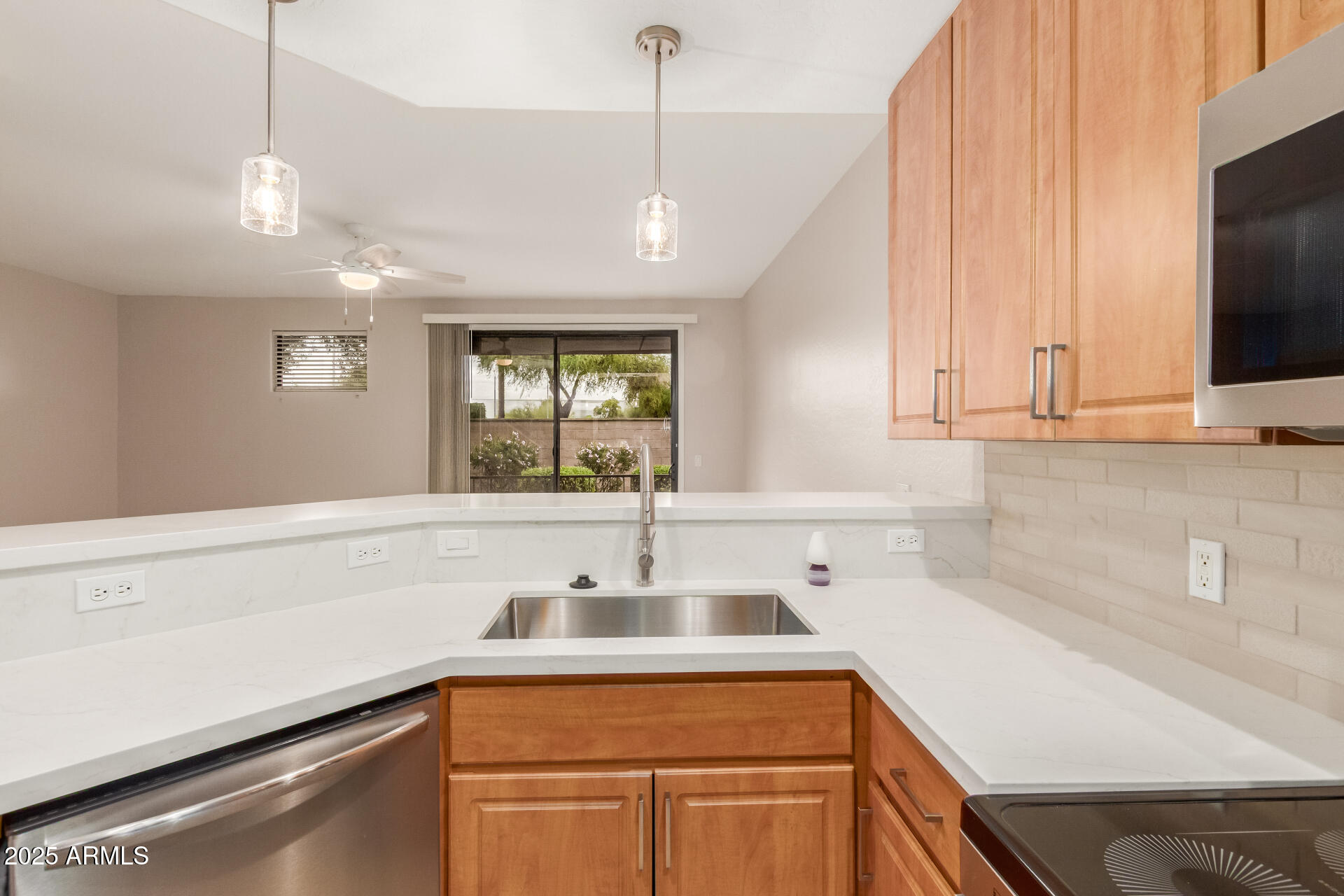 705 West Queen Creek Road, Unit 1208 Chandler, AZ 85248 - Photo 9 of 39 a kitchen with a sink and a window