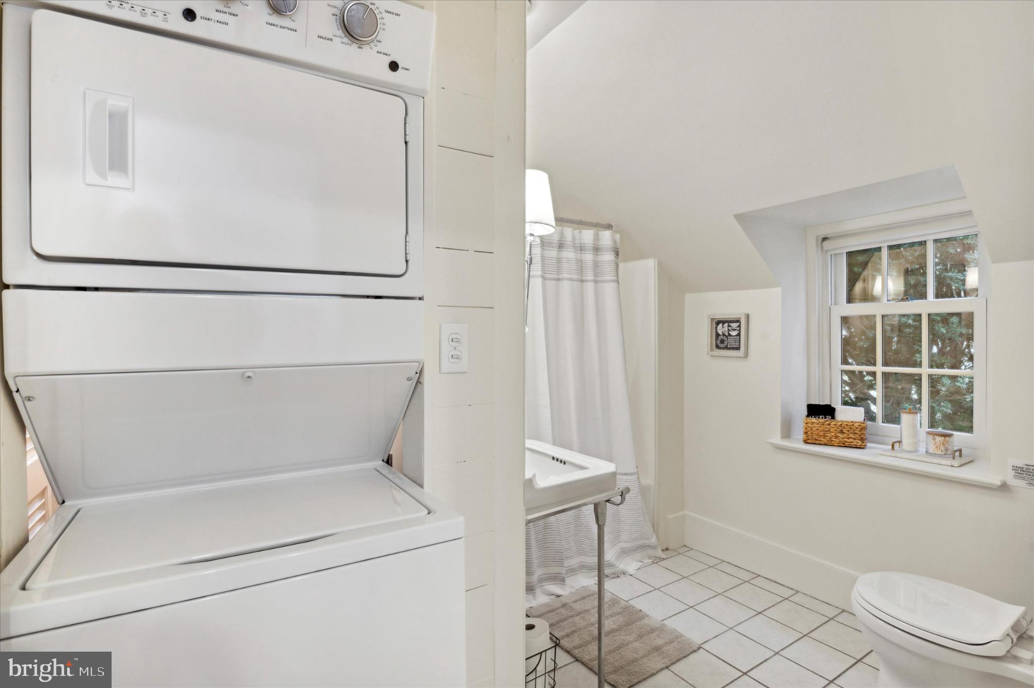 565 Upper Pike Creek Road Newark, DE 19711 - Photo 18 of 23 Charming laundry nook in a bright bathroom.