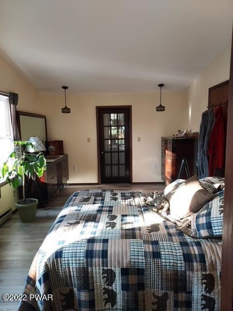 111 Rodeo Lane Hawley, PA 18428 - Photo 2 of 23 a bedroom with bed and a potted plant