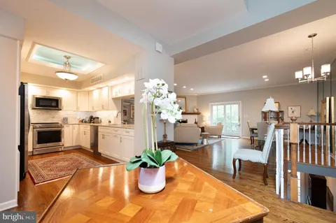 a living room with dining room and a table