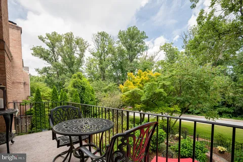 a view of a balcony with furniture