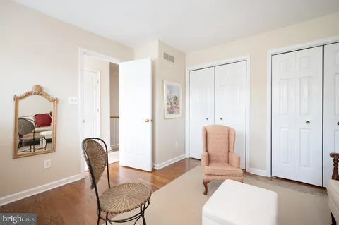 a living room with furniture and a painting