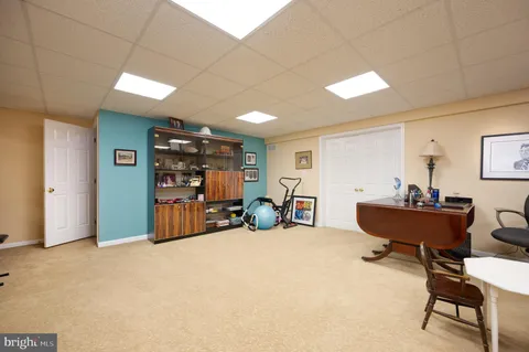 a bed room with furniture and a large window