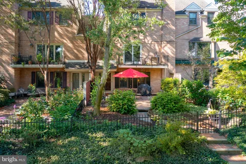 a view of a house with a yard and garden