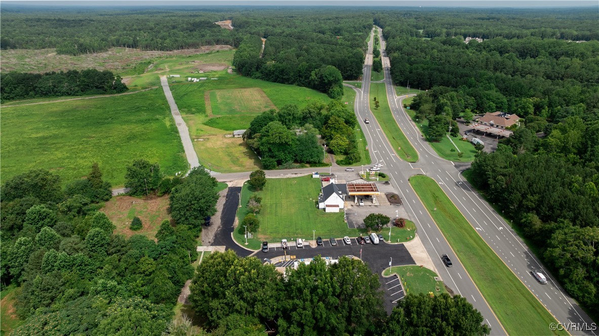 9131 Barhamsville Road Toano, VA 23168 - Photo 17 of 39 an aerial view of a residential houses with outdoor space and street view