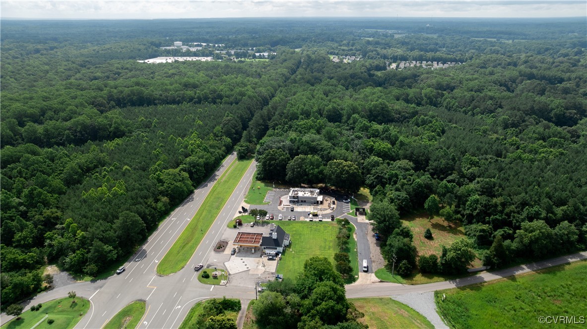 9131 Barhamsville Road Toano, VA 23168 - Photo 22 of 39 an aerial view of a house with a yard