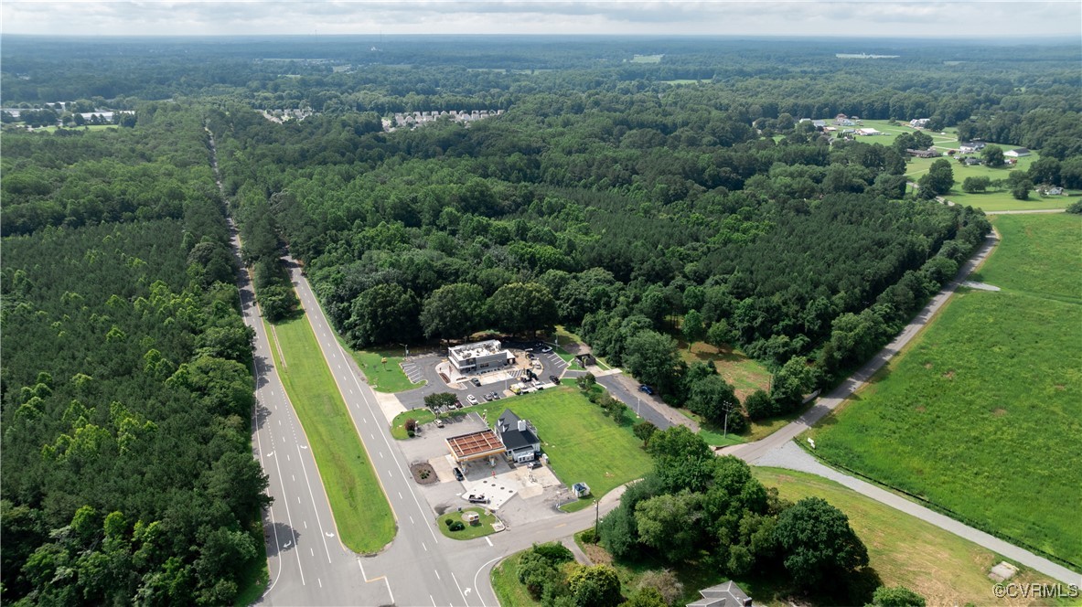 9131 Barhamsville Road Toano, VA 23168 - Photo 23 of 39 an aerial view of a house with a yard