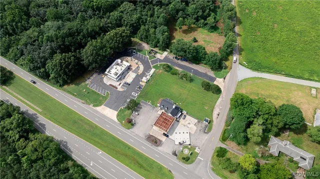 a view of a lush green forest with lots of trees