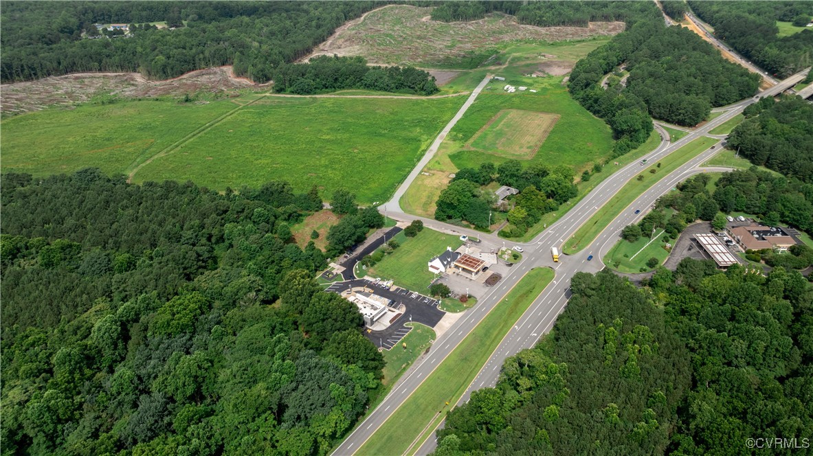 9131 Barhamsville Road Toano, VA 23168 - Photo 27 of 39 an aerial view of a residential houses with outdoor space and street view