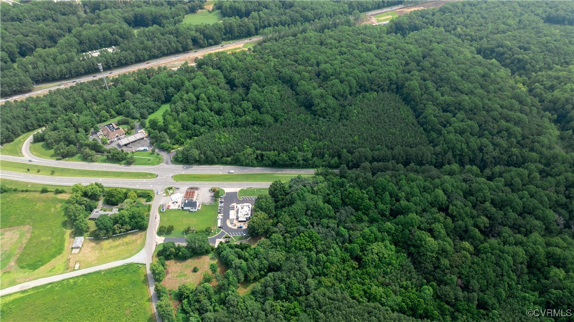 9131 Barhamsville Road Toano, VA 23168 - Photo 8 of 39 an aerial view of a houses with a yard