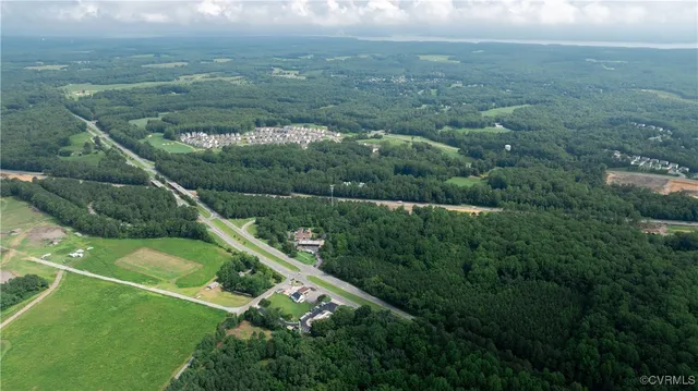 an aerial view of a house with yard swimming pool and outdoor seating
