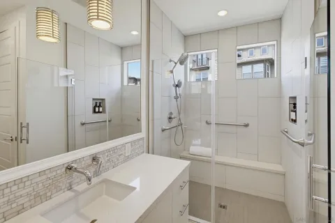 a bathroom with a sink toilet and shower