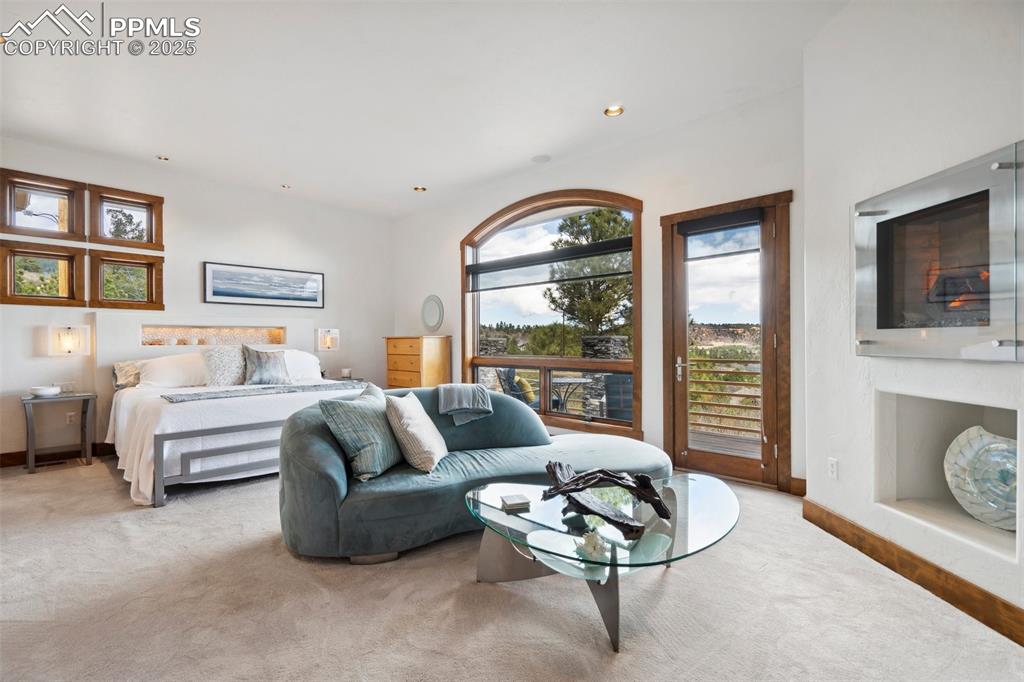 18496 Pixie Park Road Monument, CO 80132 - Photo 17 of 50 a living room with furniture and a large window