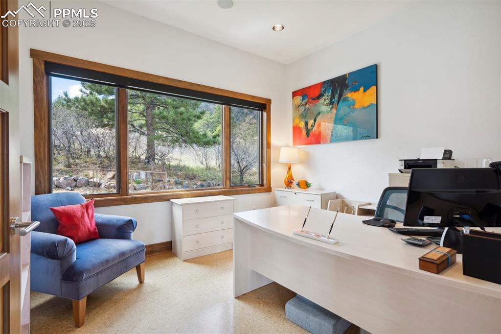 18496 Pixie Park Road Monument, CO 80132 - Photo 36 of 50 a living room with furniture and a large window