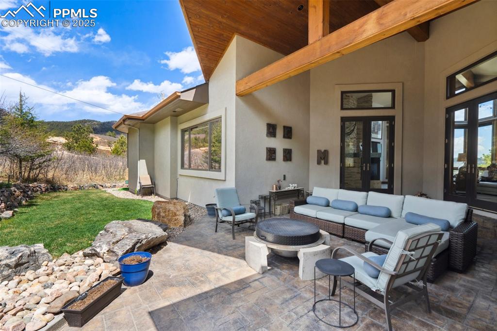 18496 Pixie Park Road Monument, CO 80132 - Photo 39 of 50 a outdoor space with patio couches and a potted plant