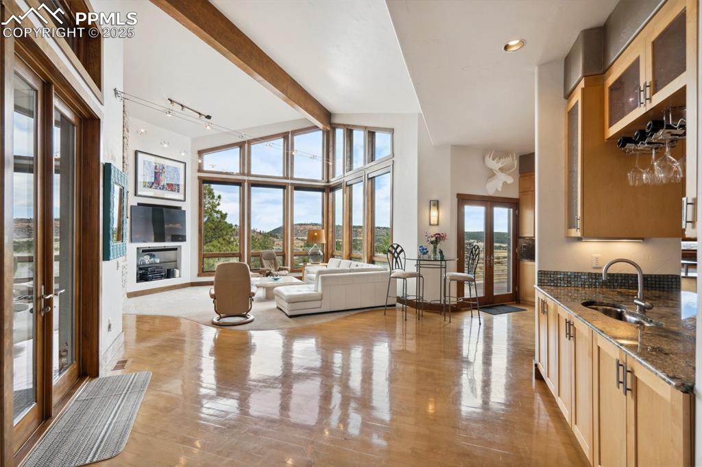 18496 Pixie Park Road Monument, CO 80132 - Photo 7 of 50 a view of living room with furniture and floor to ceiling window