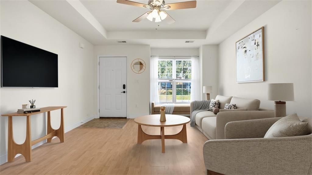 607 Locust Street Coraopolis, PA 15108 - Photo 5 of 18 a living room with furniture a flat screen tv and a window