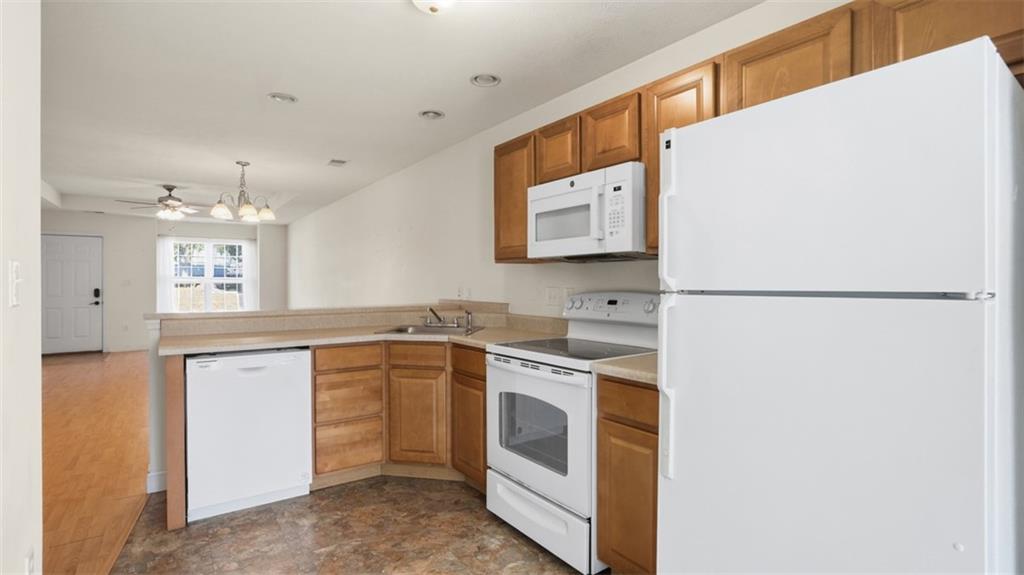 607 Locust Street Coraopolis, PA 15108 - Photo 8 of 18 a kitchen with a stove a sink and a refrigerator
