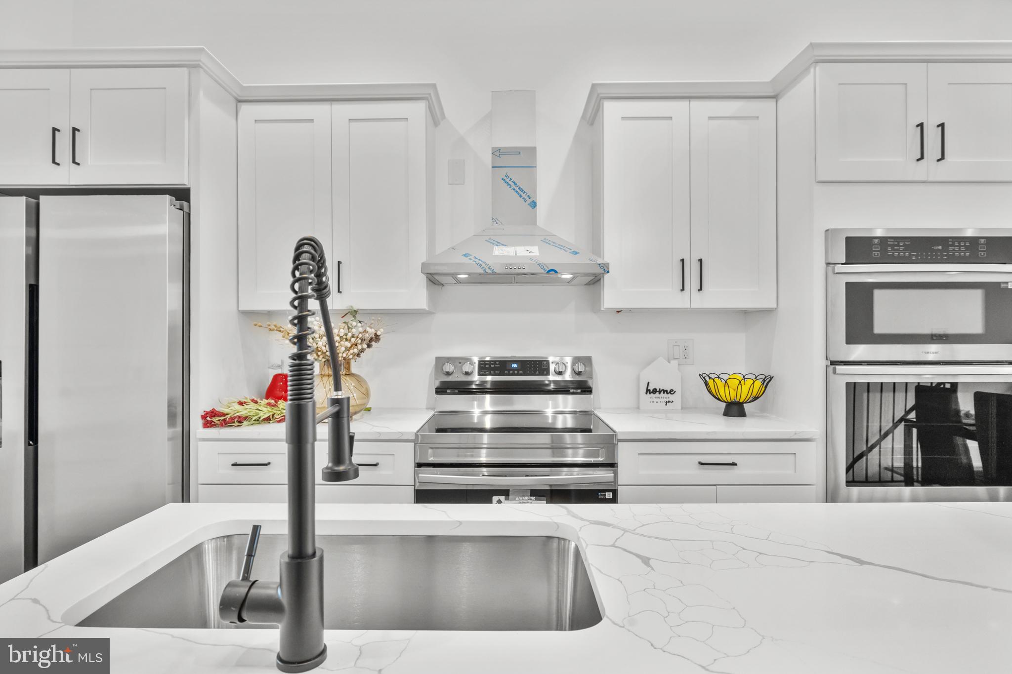 113 18th Street Southeast, Unit 2 Washington, DC 20003 - Photo 12 of 39 a kitchen with stainless steel appliances and a sink