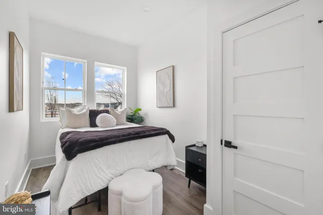 a bedroom with a bed and a table in it