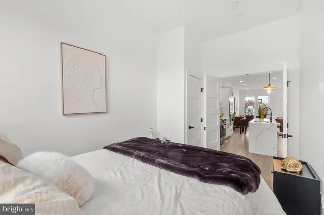 a bedroom with a bed and a mirror