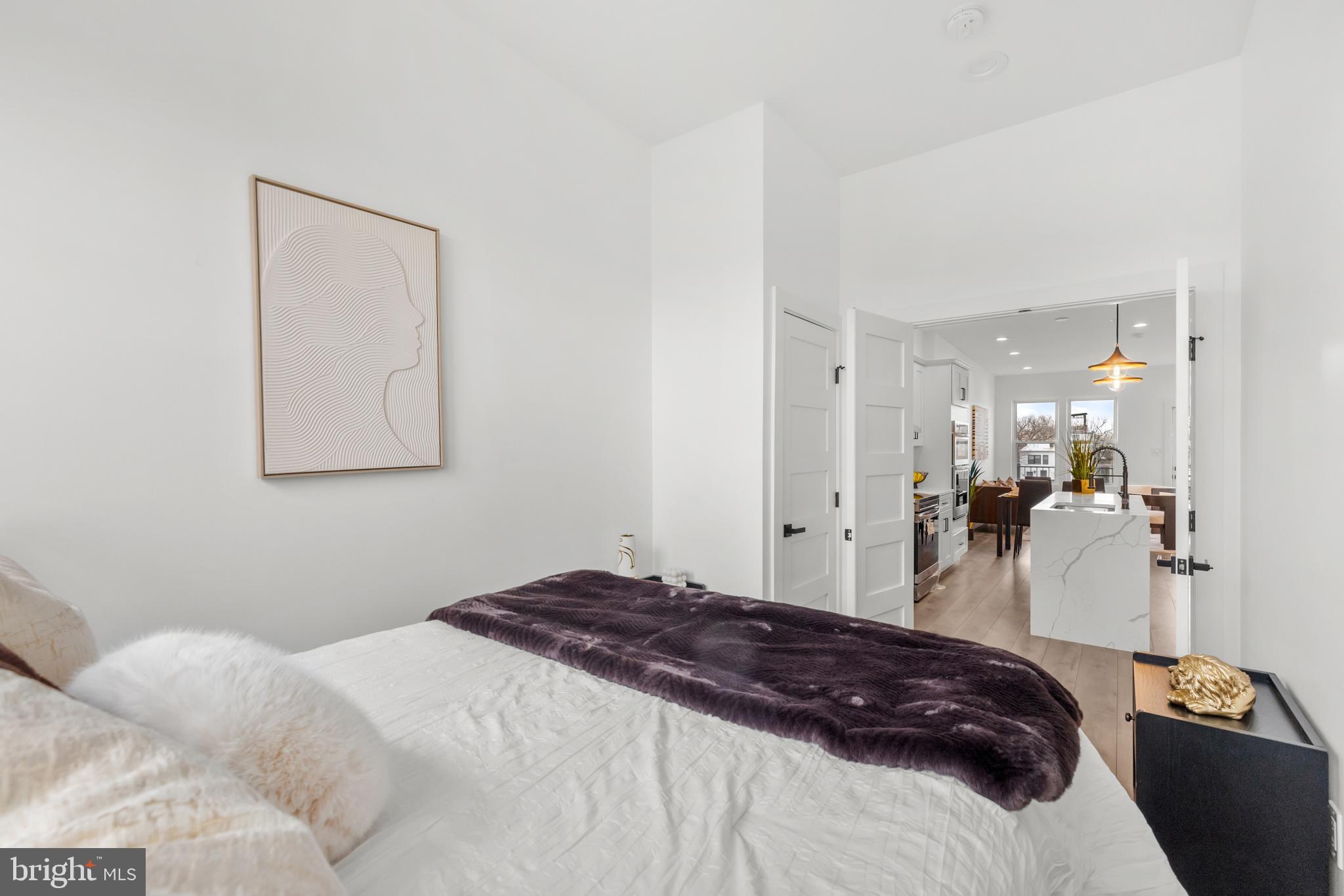 113 18th Street Southeast, Unit 2 Washington, DC 20003 - Photo 15 of 39 a bedroom with a bed and a mirror