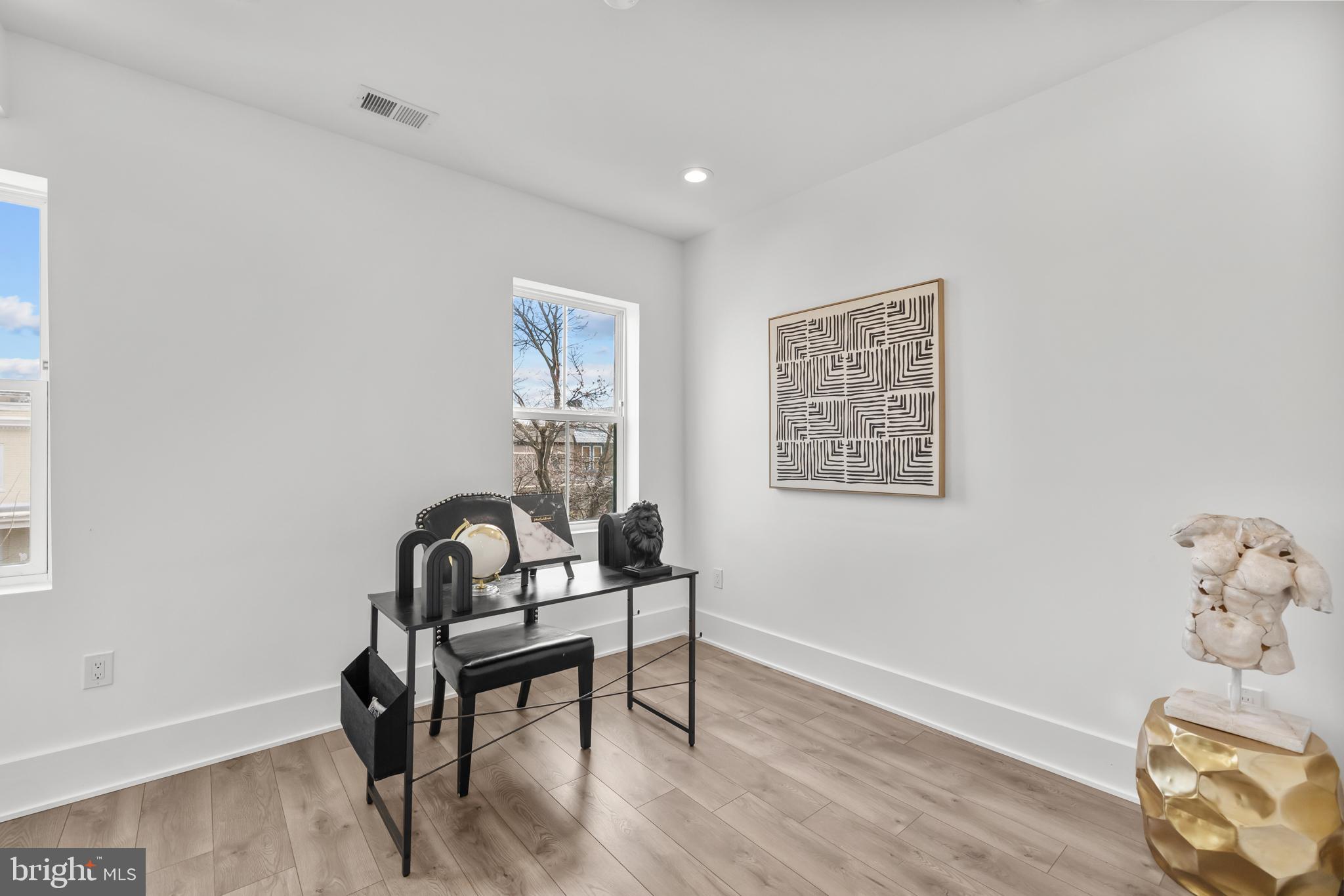 113 18th Street Southeast, Unit 2 Washington, DC 20003 - Photo 19 of 39 a view of a workspace with furniture and wooden floor