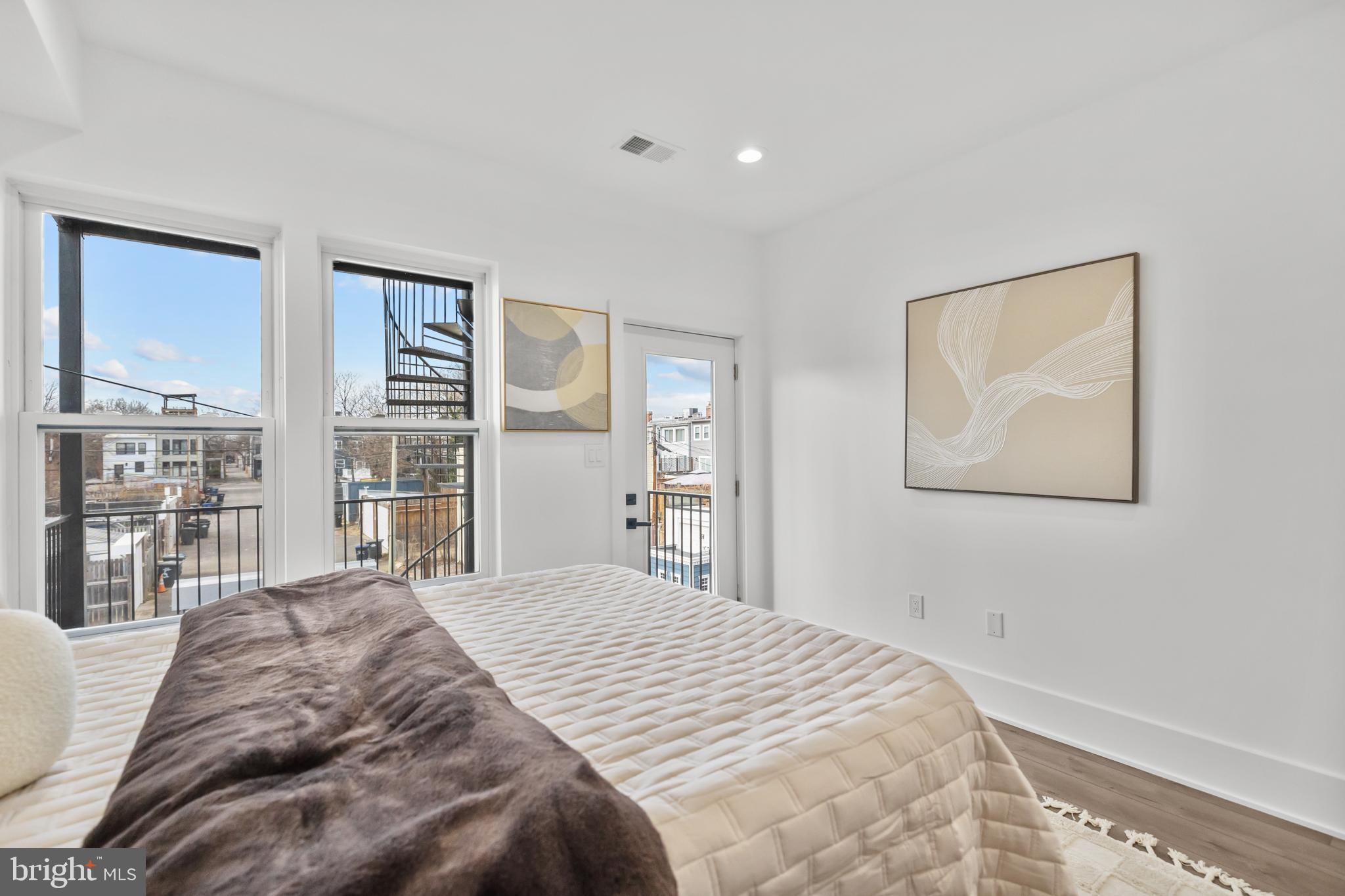 113 18th Street Southeast, Unit 2 Washington, DC 20003 - Photo 24 of 39 a bedroom with a large bed and a window