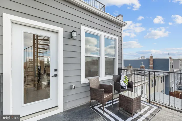 a view of a balcony with wooden floor